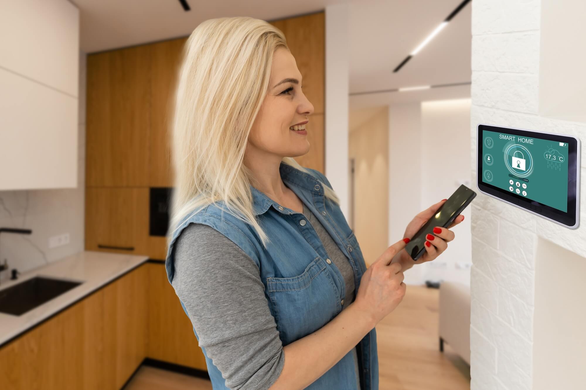 pretty-blonde-woman-using-smart-home-control-panel-.jpg